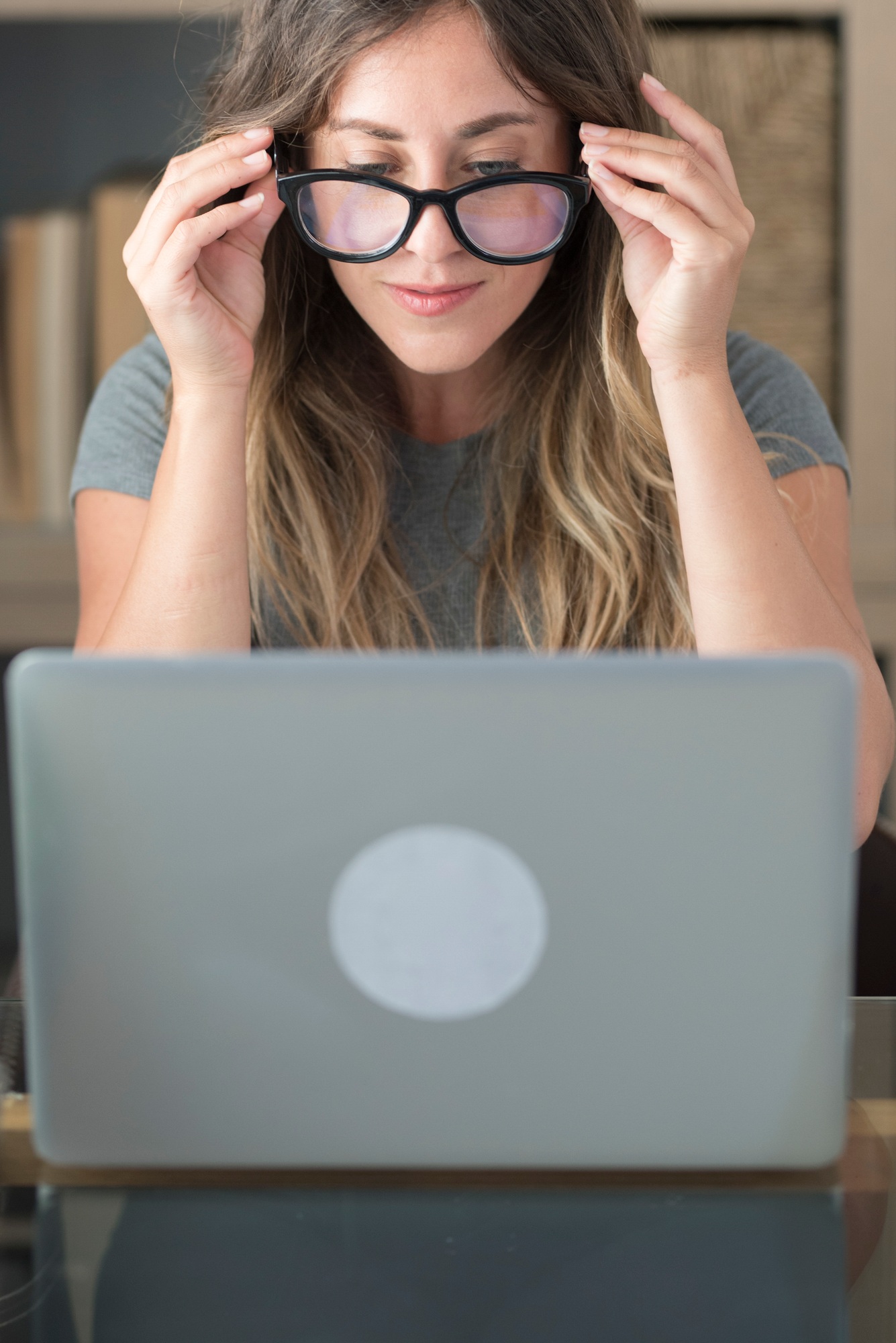 Pretty woman with glasses eyewear work at home on laptop computer - smart working female