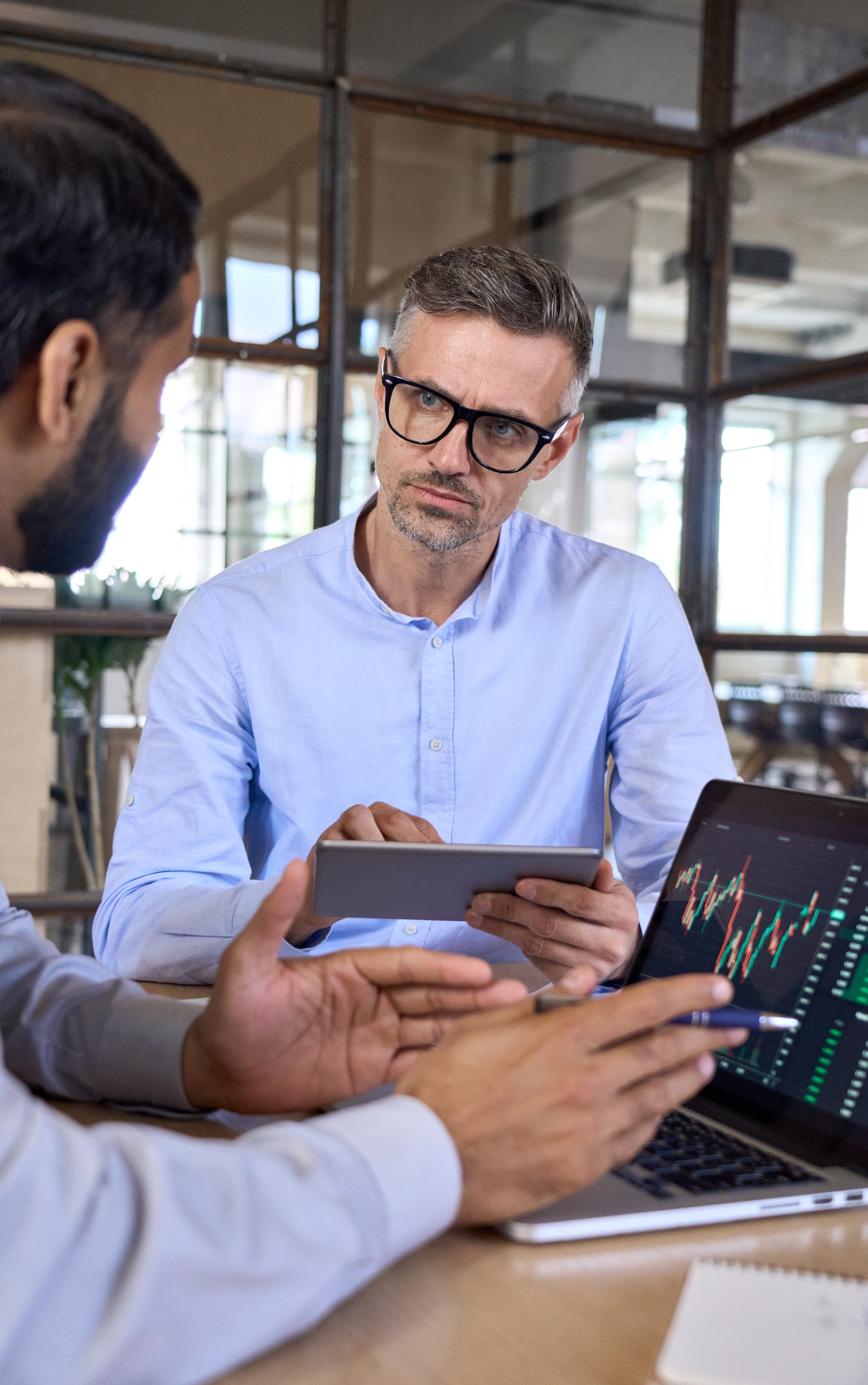 Two traders brokers stock exchange market investors discussing crypto trading.